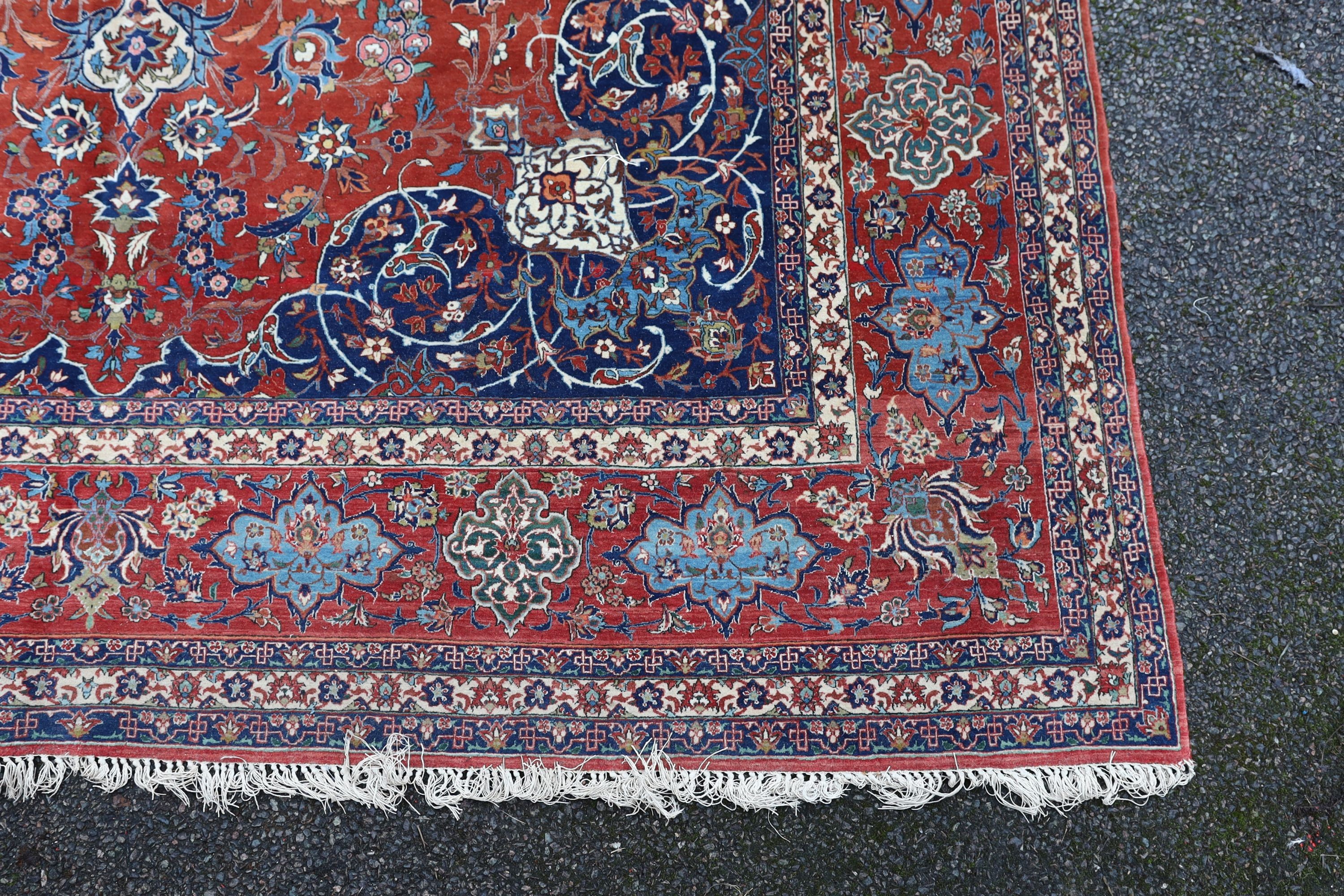 A Isfahan red ground carpet 350 x 260cm.